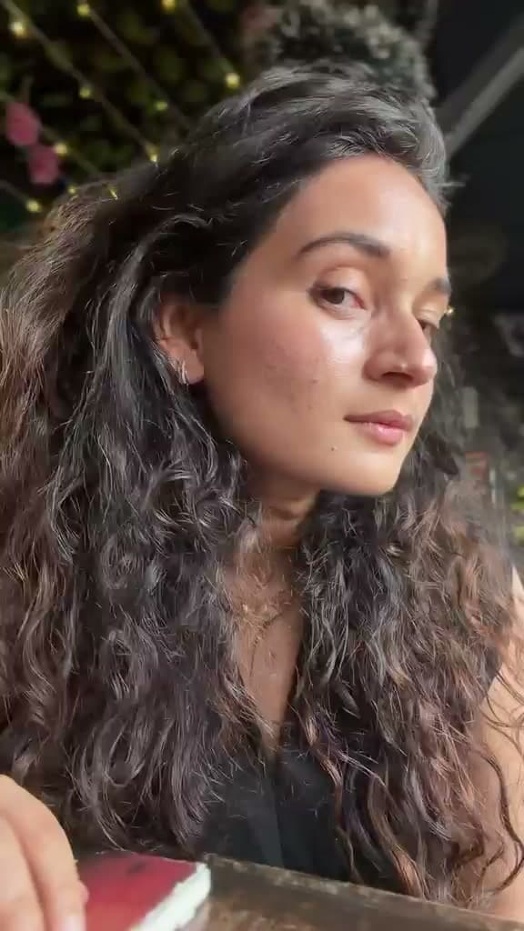 Aishwarya Kandpal in natural light with her wavy hair unstyled